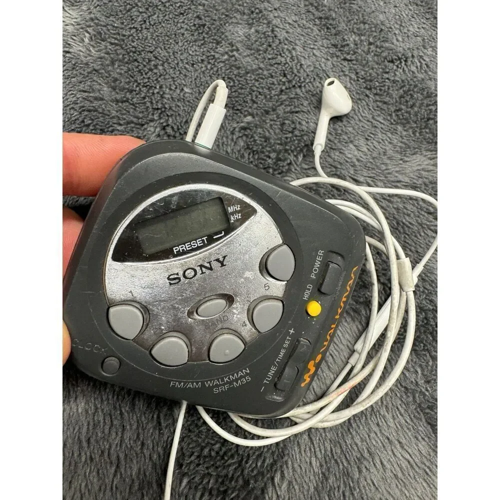Vintage Compact Sony Am/FM Walkman with Apple Earpods w/Mic. Works great! Runs